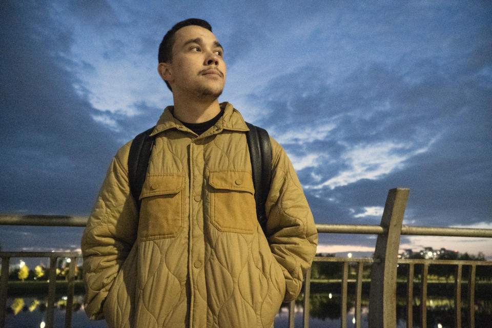 Farhad Ziganshin, a Russian officer who deserted in 2022, takes a walk after work in Astana, Kazakhstan, in late 2023. He dreams of starting a family but can't afford to take a woman out to the movies. "I can't fall in love with someone and have someone fall in love with me," he said. "So I just walk around and sing songs." (AP Photo)