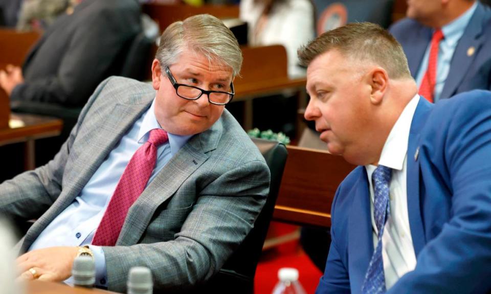 Rep. Grey Mills, left, talks with Rep. Jason Saine before the start of session in the N.C. House Tuesday, June 11, 2024.