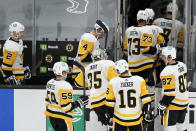 Pittsburgh Penguins goaltender Tristan Jarry (35) follows teammates off the ice after giving up the game winning during the overtime period of an NHL hockey game, Tuesday, Jan. 26, 2021, in Boston. The Bruins won 3-2. (AP Photo/Charles Krupa)