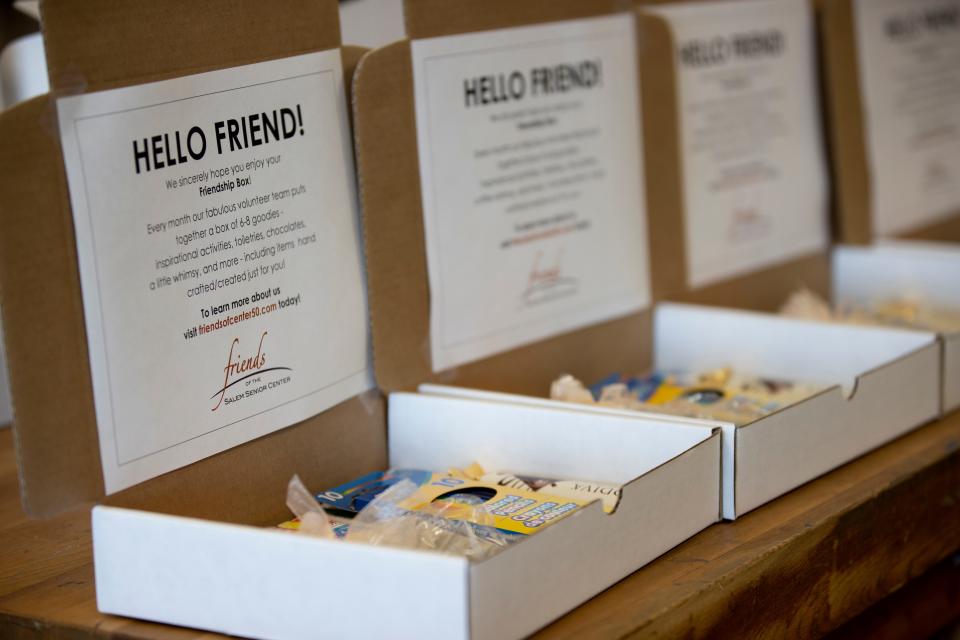 Center 50+ volunteers during the pandemic prepared friendship boxes filled with games and treats for older residents.