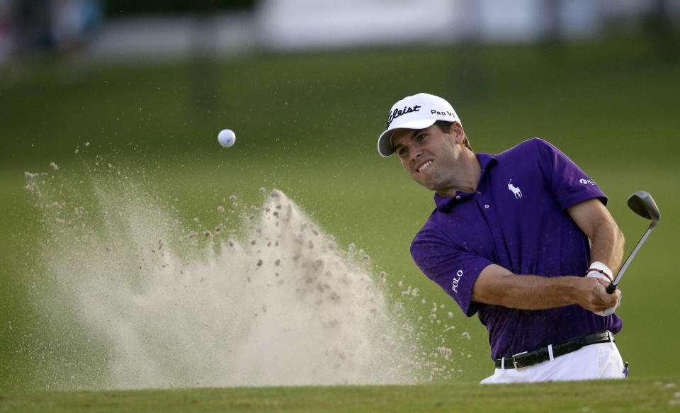 Ben Martin hits out of the sand onto the 18th green during the opening round of the PGA Zurich Classic golf tournament at TPC Louisiana in Avondale, La., Thursday, April 24, 2014. Martin treated a tiny gallery to a course-record round, shooting a 10-under 62 on Thursday. (AP Photo/Gerald Herbert)