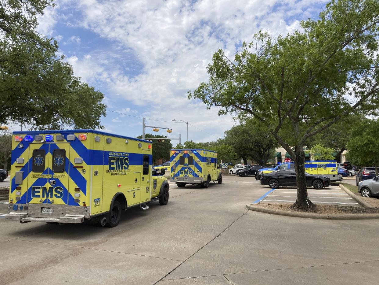 Emergency personnel work at the scene of a fatal shooting on Sunday, April 18, 2021, in Austin, Tex. Several people were fatally shot in Austin on Sunday and no suspects are in custody, emergency responders said. Police said on Twitter that they were on the scene of an active shooting and asked nearby residents to shelter in place and avoid the area.