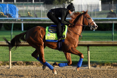 FILE PHOTO: An exercise rider works out Kentucky Derby hopeful Justify at Churchill Downs in Louisville, Kentucky, U.S., May 1, 2018. Jamie Rhodes-USA TODAY Sports