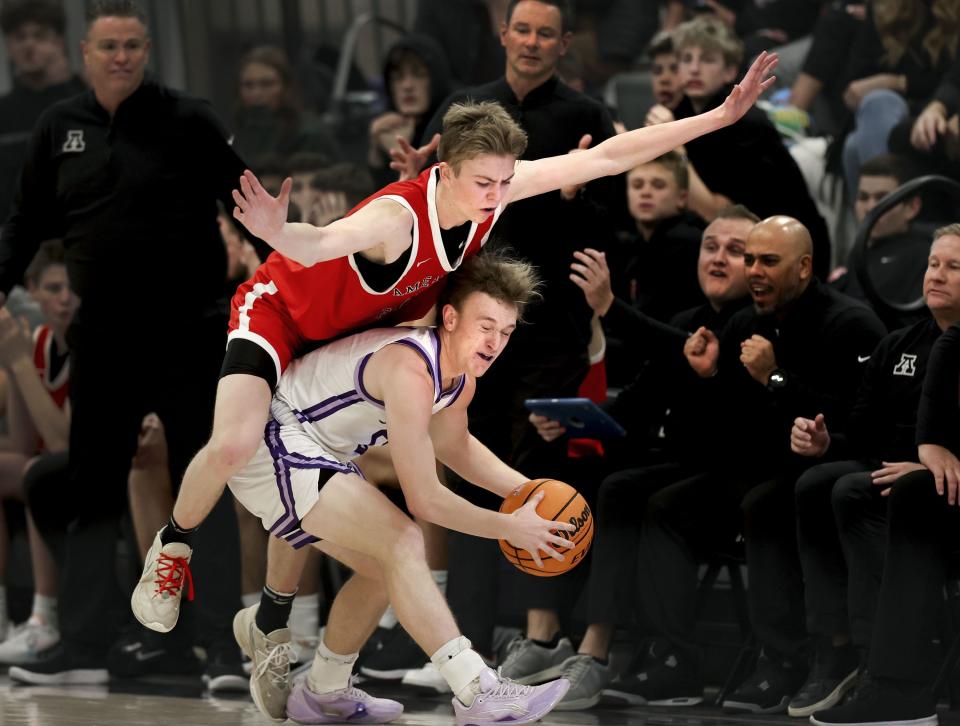 American Fork’s Tiger Cuff falls onto Lehi’s Jace John at Lehi High School on Friday, Jan. 12, 2024. | Laura Seitz, Deseret News