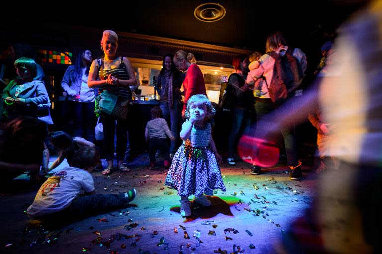 Fifteen-month-old Grace enjoys the music and entertainment at the Big Fish Little Fish "2-4 Hour Party People" event in Brixton, South London, on April 12, 2014