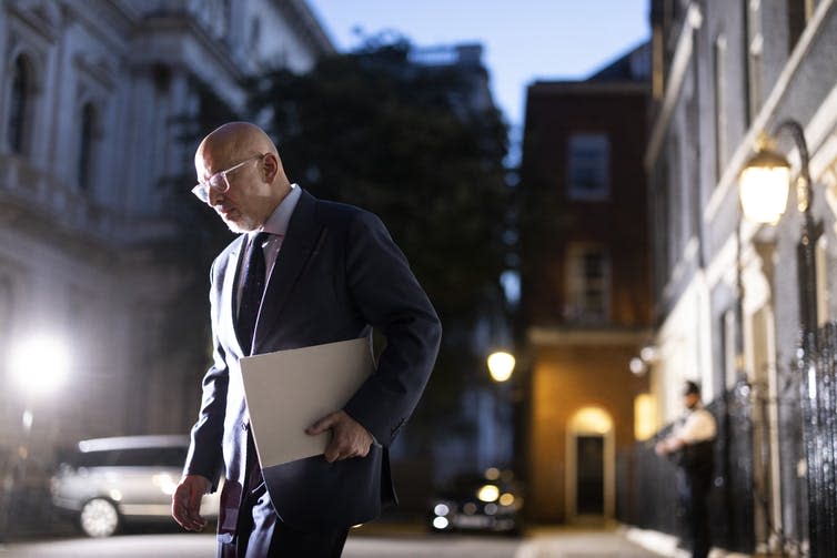 Nadhim Zahawi leaving Downing Street at night.