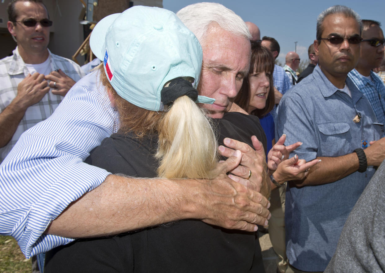 Vice President Mike Pence hugs a woman during a trip to survey the damage from Hurricane Harvey in Rockport, Texas, on Aug. 31.&nbsp; (Photo: Bloomberg via Getty Images)