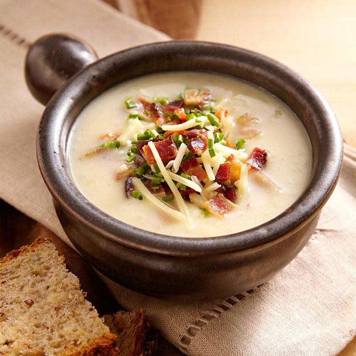 <p>This healthy loaded baked potato soup recipe is inspired by the comforting flavor of fully loaded baked potatoes with bacon, Cheddar, sour cream and chives. To make a vegetarian version of this potato soup, omit the bacon and use "no-chicken" broth. Serve it with a green salad and crusty bread to clean up the bowl. <a href="https://www.eatingwell.com/recipe/250812/loaded-baked-potato-soup/" rel="nofollow noopener" target="_blank" data-ylk="slk:View Recipe" class="link rapid-noclick-resp">View Recipe</a></p>