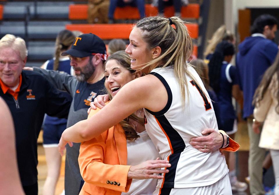 Tecumseh's Alli Zajac hugs her coach and mother, Kristy Zajac, after beating Chelsea on Tuesday.
