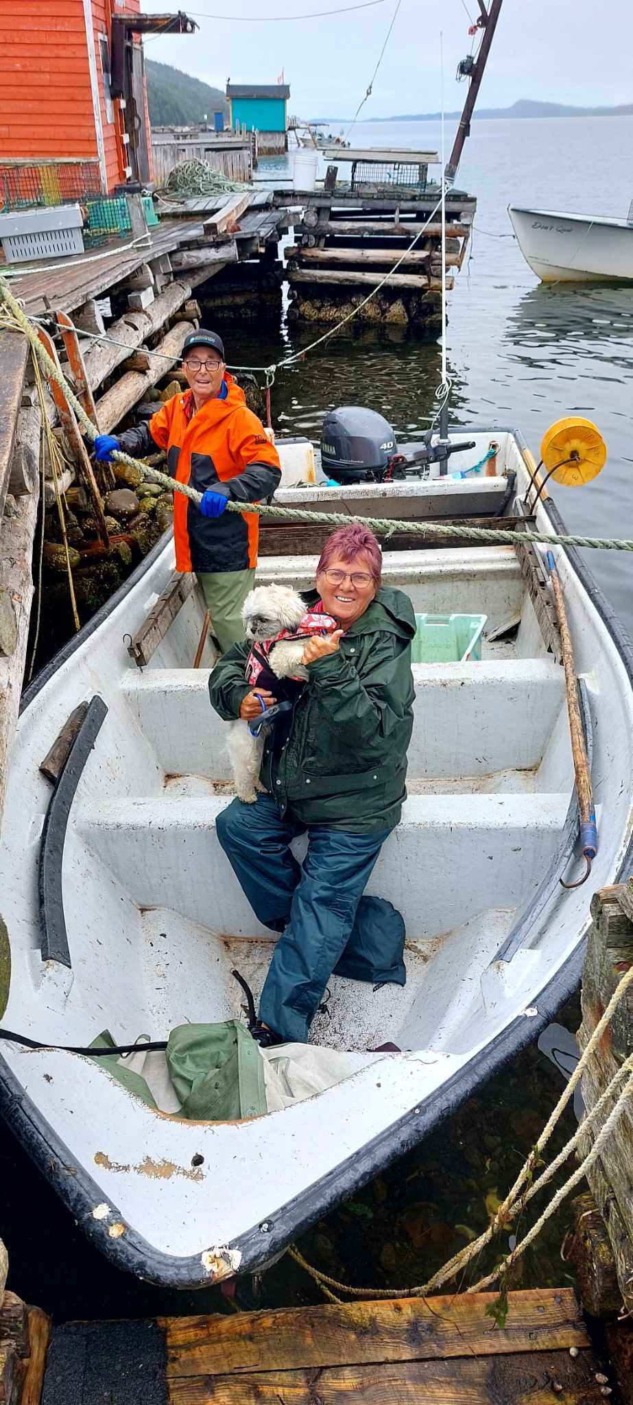 Minutes after arriving in Middle Arm, Alice Auburtine was invited to go cod jigging for the first time. Her little dog and traveling companion tagged along. 