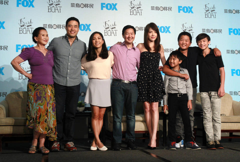 FILE - In this Friday, Aug. 5, 2016 file photo, actors, from left, Lucille Soong, Randall Park, Constance Wu, Ken Jeong, Ann Hsu, Ian Chen, Hudson Yang and Forrest Wheeler pose for photographers during a media event promoting their television comedy series "Fresh off the Boat" in Taipei, Taiwan. The sitcom was the first American TV show to film on location in Taiwan and the first to have a majority of dialogue in Mandarin in one episode. (AP Photo/Chiang Ying-ying)