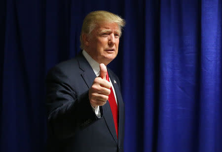 Donald Trump gestures at the Republican National Convention in Cleveland, Ohio, July 21, 2016. REUTERS/Aaron Josefczyk