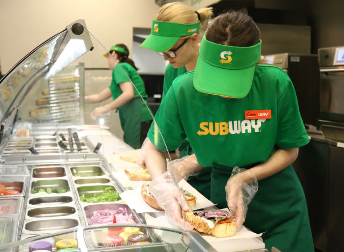Subway worker making sandwich
