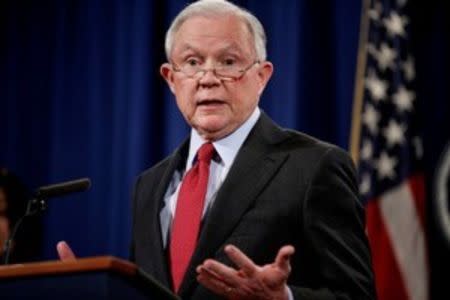 FILE PHOTO: U.S. Attorney General Jeff Sessions speaks during a news conference to discuss "efforts to reduce violent crime" at the Department of Justice in Washington, U.S., December 15, 2017. REUTERS/Joshua Roberts/File Photo