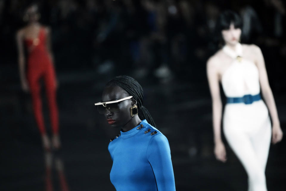 Models wear creations for Saint Laurent Spring-Summer 2022 ready-to-wear fashion show presented Tuesday, Sept. 28, 2021, in Paris. (AP Photo/Thibault Camus)