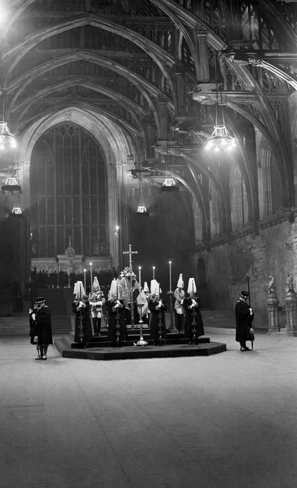 FILE - A view of the pall covered coffin of King George V, lying in Westminster Hall, London, on Jan. 23, 1936. Hundreds of thousands of people are expected to flock to London’s medieval Westminster Hall from Wednesday, Sept. 14, 2022, to pay their respects to Queen Elizabeth II, whose coffin will lie in state for four days until her funeral on Monday. (AP Photo, File)