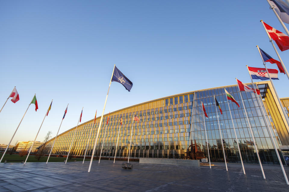 Flags of NATO members fly outside the NATO headquarters, Wednesday, Nov. 16, 2022 in Brussels. Ambassadors from the 30 NATO nations gathered for emergency talks after Poland said that a Russian-made missile fell on its territory killing two people and U.S. President Joe Biden and his allies promised support for the investigation into the incident. (AP Photo/Olivier Matthys)