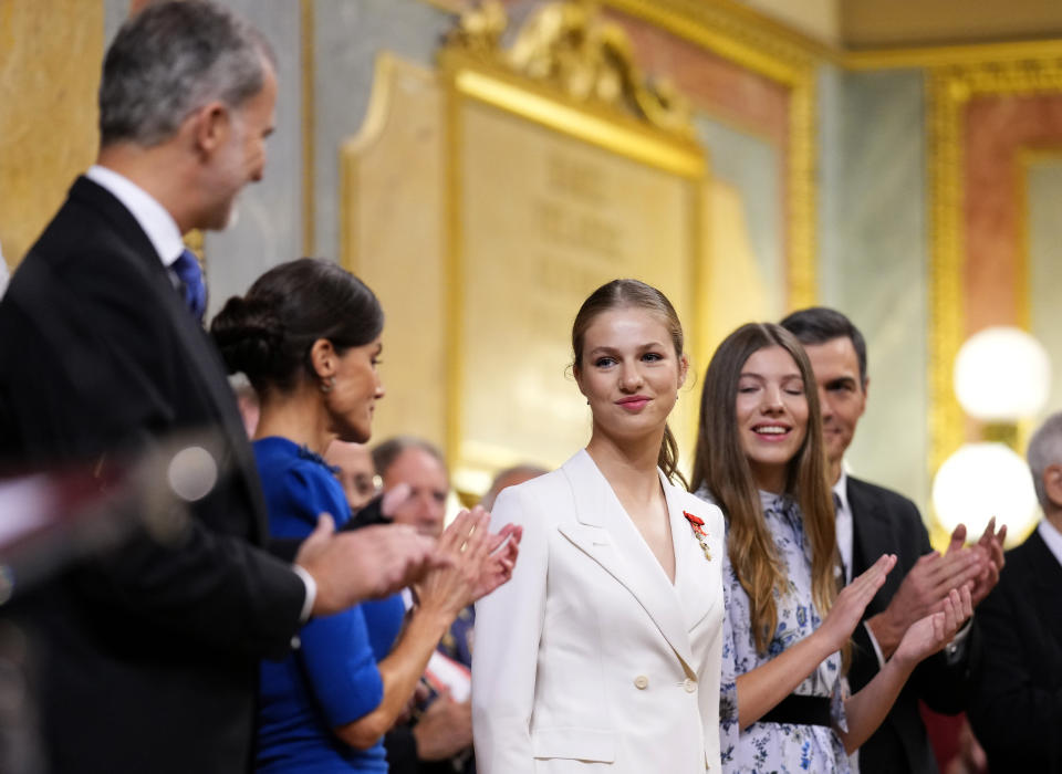 Princess Leonor, center, receives the applause of Spanish King Felipe VI, Queen Letizia and her sister Sofia, right, after swearing allegiance to the Constitution during a gala event that makes her eligible to be queen one day, in Madrid on Tuesday, Oct. 31 2023. The heir to the Spanish throne, Princess Leonor, is to swear allegiance to the Constitution on her 18th birthday Tuesday, in a gala event that paves the way to her becoming queen when the time comes. Leonor is the eldest daughter of King Felipe and Queen Letizia. (AP Photo/Manu Fernandez)