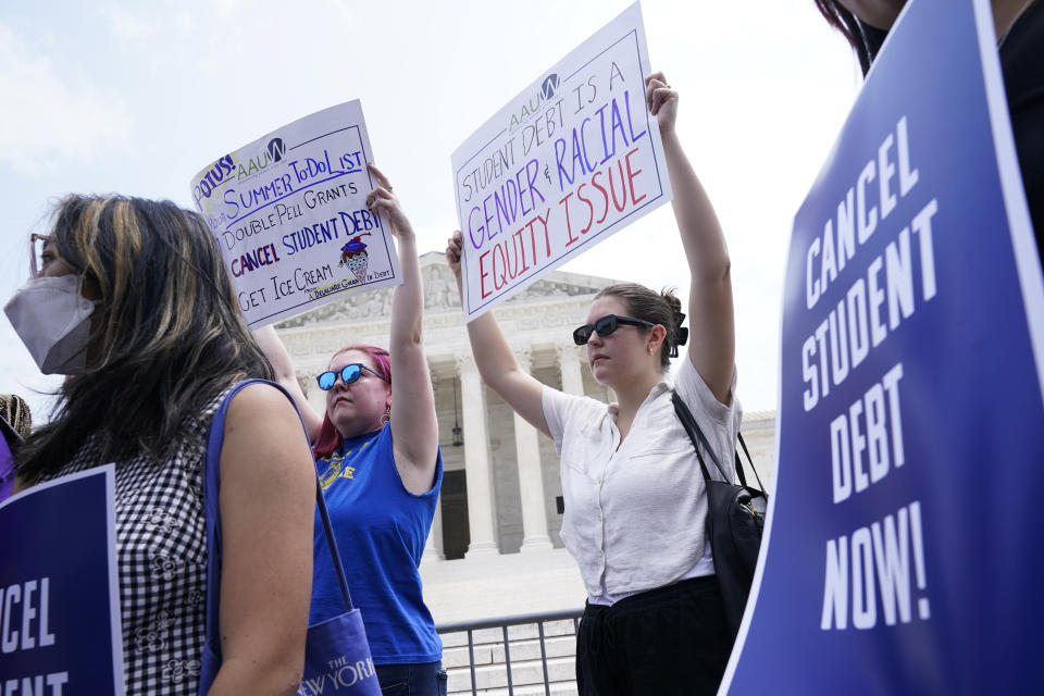 People demonstrate outside the Supreme Court, Friday, June 30, 2023, in Washington. A sharply divided Supreme Court has ruled that the Biden administration overstepped its authority in trying to cancel or reduce student loan debts for millions of Americans. Conservative justices were in the majority in Friday's 6-3 decision that effectively killed the $400 billion plan that President Joe Biden announced last year. (AP Photo/Jacquelyn Martin)