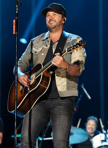 <p>Terry Wyatt/WireImage</p> Luke Bryan performs in Nashville in June 2023