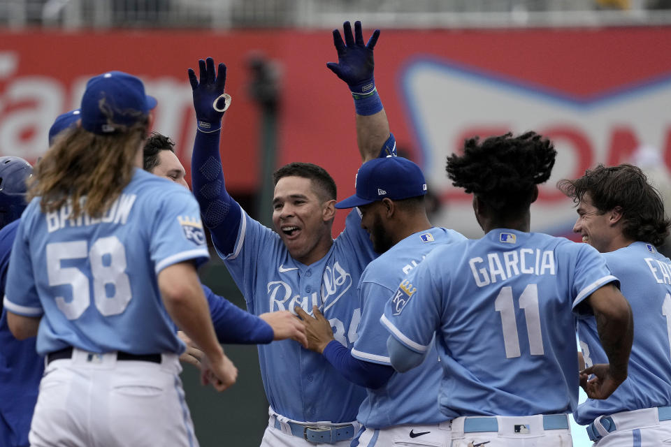 Kansas City Royals' Freddy Fermin, center, celebrates with teammates after their baseball game against the Chicago White Sox Thursday, May 11, 2023, in Kansas City, Mo. The Royals won 4-3. (AP Photo/Charlie Riedel)