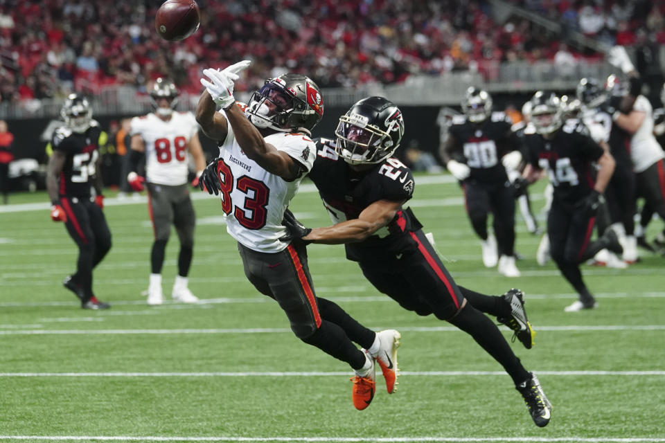 Tampa Bay Buccaneers wide receiver Deven Thompkins (83) misses the catch against Atlanta Falcons cornerback A.J. Terrell (24) during the first half of an NFL football game, Sunday, Jan. 8, 2023, in Atlanta. (AP Photo/John Bazemore)