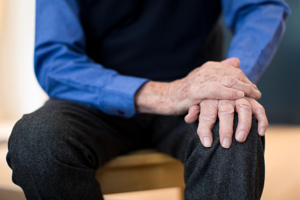 Close Up Of Senior Man Suffering With Parkinsons Diesease