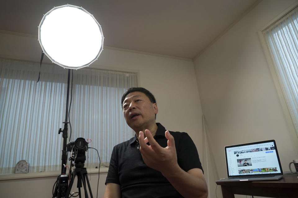 Wang Zhi'an speaks during an interview with the Associated Press in Tokyo on Oct. 5, 2022. Chinese investigative journalist Wang once exposed corruption, land seizures, and medical malpractice for state broadcaster CCTV. Today, he's in exile in Japan, and starting again as an independent journalist on YouTube. (AP Photo/Eugene Hoshiko)