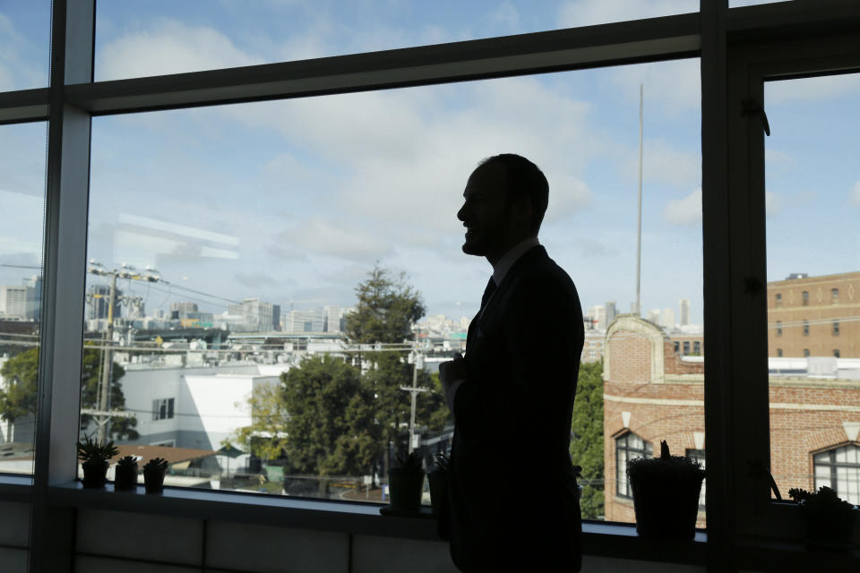 San Francisco District Attorney Chesa Boudin is silhouetted looking out at the skyline from his office in San Francisco on Jan. 30, 2020. Boudin took office as district attorney in San Francisco a year ago as part of a politically progressive wave of prosecutors committed to seeking restorative justice over mass incarceration. But now the former deputy public defender is under fire for the deaths of two pedestrians on New Year's Eve who were run down in an intersection by a 45-year-old parolee. (AP Photo/Eric Risberg)