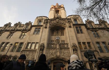 Journalists gather outside the Supreme Court ahead of the challenge against a court ruling that Theresa May's government requires parliamentary approval to start the process of leaving the European Union, in Parliament Square, central London, Britain December 5, 2016. REUTERS/Toby Melville