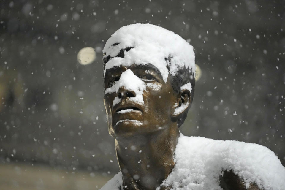 Former Utah Jazz player John Stockton's bronze statue is shown during a snow storm before an NBA basketball game against the Denver Nuggets Wednesday, Jan. 10, 2024, outside of the Delta Center, in Salt Lake City. (AP Photo/Rick Bowmer)
