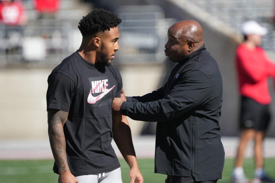 Apr 13, 2024; Columbus, OH, USA; Ohio State Buckeyes running back TreVeyon Henderson (32) talks with Ohio State Buckeyes running backs coach Carlos Locklyn before the Ohio State football spring game at Ohio Stadium.