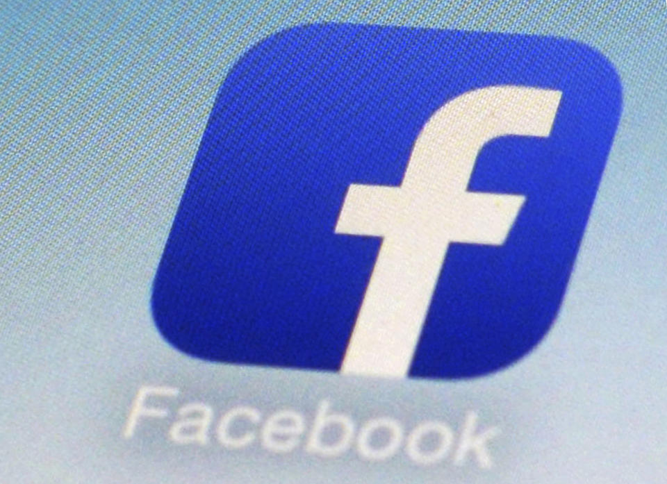 FILE - This Feb. 19, 2014, file photo, shows a Facebook app icon on a smartphone in New York. The ACLU is accusing Facebook of discrimination, saying the company violated federal and state laws prohibiting businesses from excluding women from job ads. In a complaint filed Tuesday, Sept. 18, 2018, with the Equal Employment Opportunity Commission, the ACLU also lists 10 employers that it claims have placed discriminatory ads. (AP Photo/Patrick Sison, File)