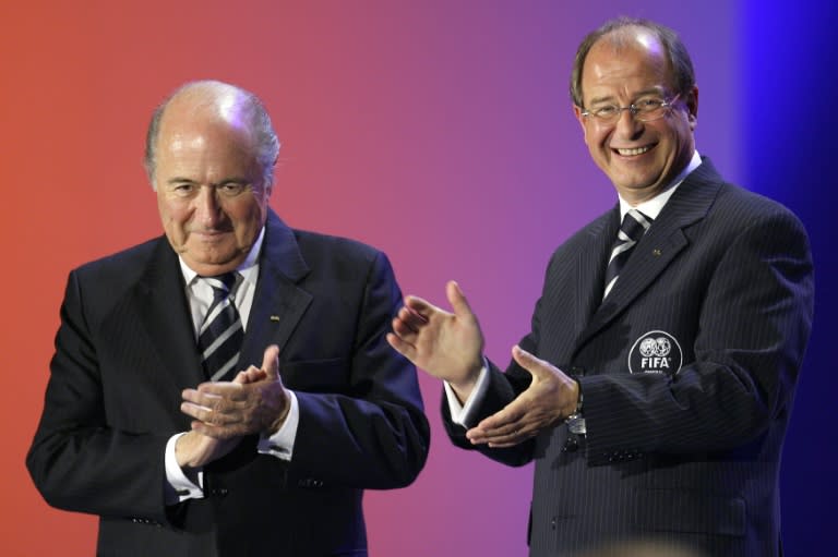 FIFA President Sepp Blatter (left) and FIFA General Secretary Urs Linsi applaud during the opening ceremony of the 57th congress of the world football governing body in Zurich on May 30, 2007