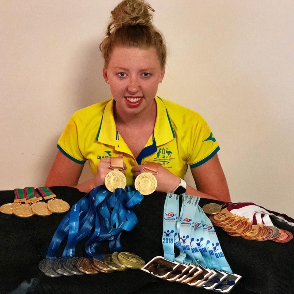 Lakeisha 'Lucky' Patterson, Paralympic gold medallist, displays her various swimming medals which includes two golds from Rio 2016