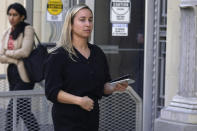 Carli Skaggs, the widow of Tyler Skaggs, walks out of a federal court building after testifying in Fort Worth, Texas, Tuesday, Feb. 15, 2022. Former Los Angeles Angels employee Eric Kay is accused of providing Tyler Skaggs the drugs that led to the pitcher's overdose death. The 27-year-old Skaggs was found dead in July 2019 in a suburban Dallas hotel room. (AP Photo/LM Otero)