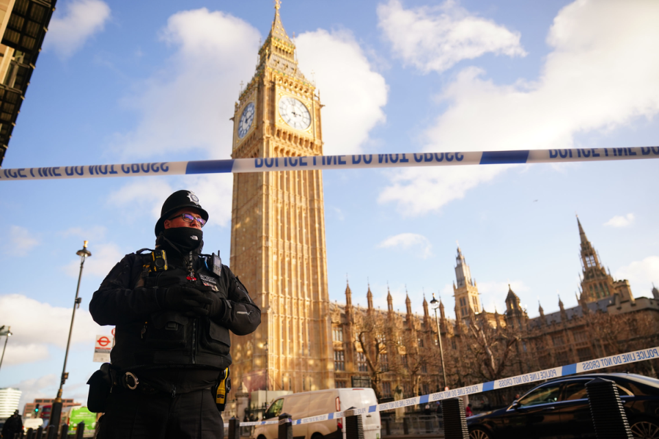 Police cordon off an area around Portcullis House after debris fell from a building (PA)