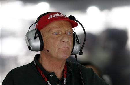 Former Formula One champion Niki Lauda of Austria follows the first practice session of the Bahrain F1 Grand Prix at the Sakhir circuit, south of Manama April 19, 2013. REUTERS/Caren Firouz