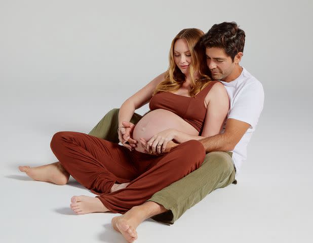 <p>Cydney Cosette/Shutterstock </p> Adrian Grenier and Jordan Grenier pose for photos before the birth of their son.