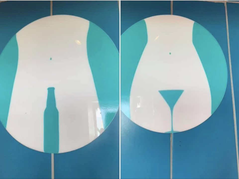 Symbols indicating restroom genders: left circle has a figure with a bottle shape, right circle has a figure with a martini glass shape