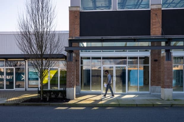 Advertisements reading 'prime retail opportunity' line the windows of vacant shops in the southern complex of the Fremont Village in Port Coquitlam. (Ben Nelms/CBC - image credit)