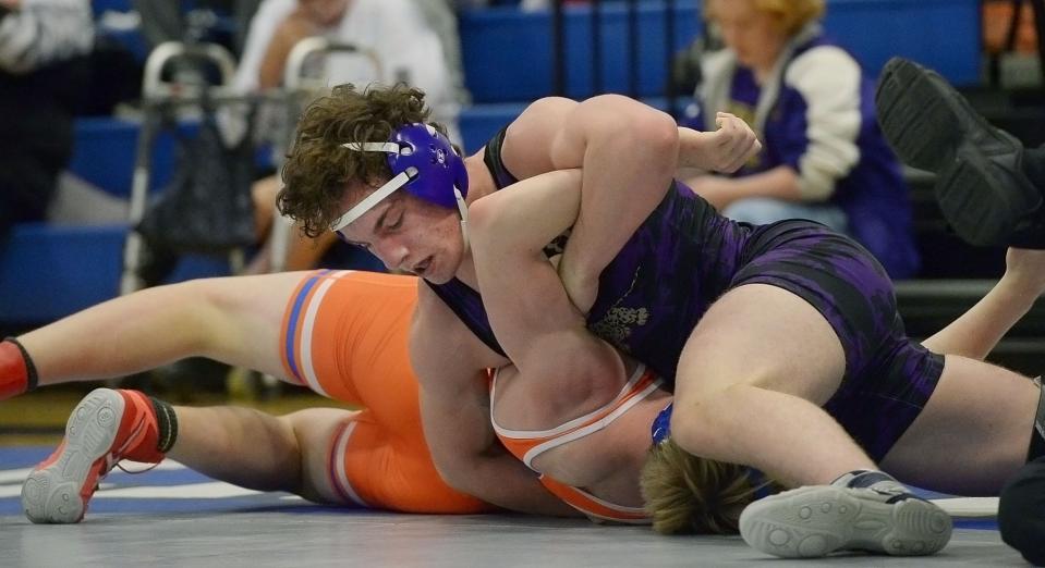 Smithsburg's James Brashears pins Boonsboro's Michael Cornell in the third period for the county title at 170 pounds.