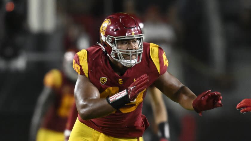 Southern California defensive lineman Tuli Tuipulotu (49) rushes Fresno State.