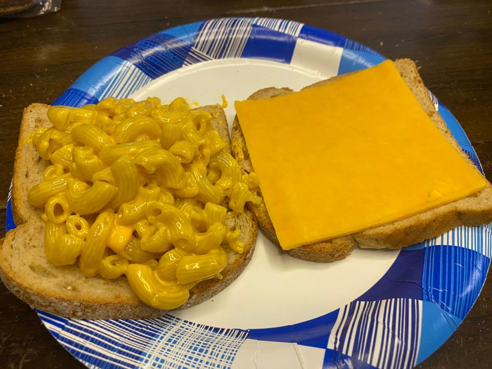 mac and cheese and cheese on bread on a plate