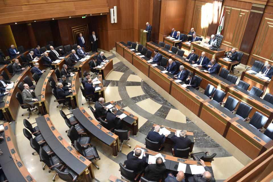 In this photo released by the Lebanese Parliament media office, Lebanese lawmakers attending a parliament session, in Beirut, Lebanon, Tuesday, April 18, 2023. Lebanon's parliament on Tuesday postponed municipal elections for up to a year for a second time amid concerns the government would not be able to secure the needed funding in time for the polling. (Hassan Ibrahim/Lebanese Parliament media office via AP)