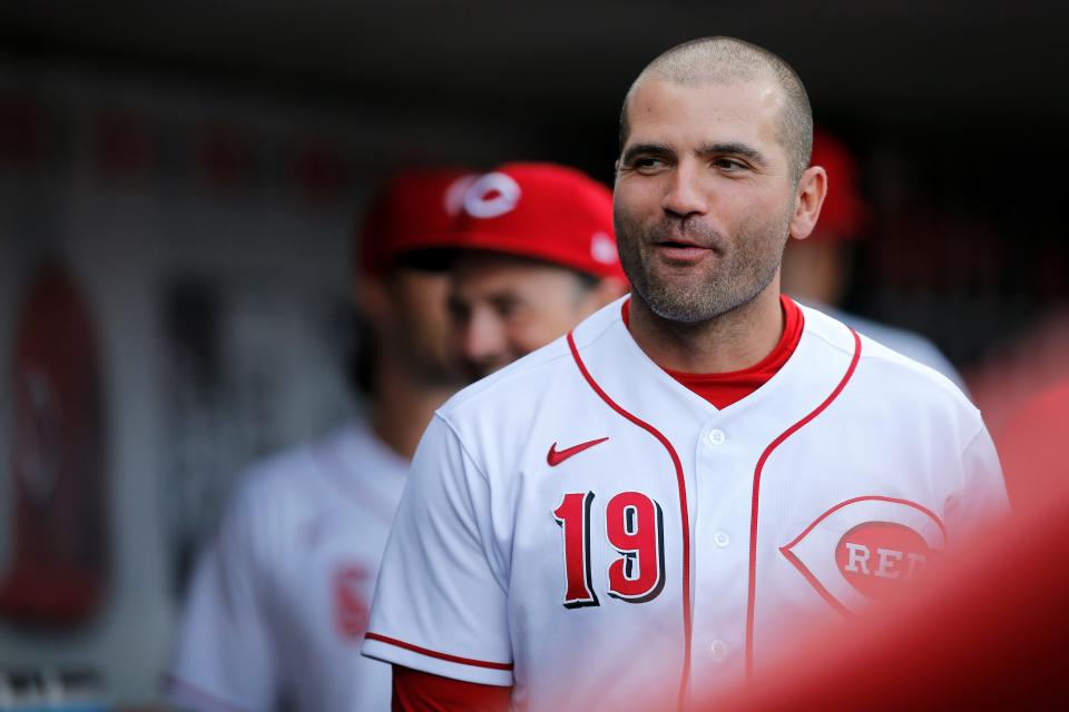 Cincinnati Reds first baseman Joey Votto (19) walks through the dugout before the first inning of the MLB National League game between the Cincinnati Reds and the Miami Marlins at Great American Ball Park in downtown Cincinnati on Tuesday, July 26, 2022.