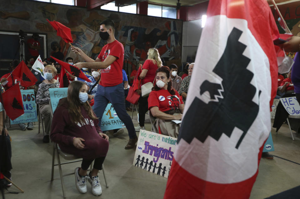 United Farm Workers gather during a Border Community Town Hall meeting at LUPE (La Union Del Pueblo Entero) where speakers slammed Texas governor Greg Abbott and former president Donald Trump border trip on Wednesday, June, 30, 2021 in San Juan, Texas. (Delcia Lopez/The Monitor via AP)