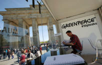 A man reads a copy of the leaked TTIP negotiations inside a public reading room by the environmental campaign group Greenpeace in front of the Brandenburg Gate in Berlin, Germany, May 2, 2016. REUTERS/Fabrizio Bensch