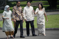 Philippine President Ferdinand Marcos Jr. second right, and his wife Madame Louise Araneta Marcos, right walk with Indonesian President Joko Widodo and his wife Iriana, left, after a tree-planting ceremony at the Presidential Palace in Bogor, Indonesia, Monday, Sept, 5, 2022.(AP Photo/Achmad Ibrahim, Pool)