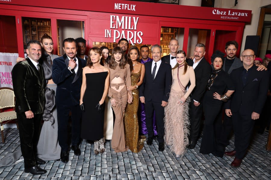 PARIS, FRANCE - DECEMBER 06: Stephen Brown, Kate Walsh, William Abadie, Samuel Arnold, Philippine Leroy-Beaulieu, Lily Burns, Lily Collins, Tony Hernandez, Ashley Park, Lucien Laviscount, Darren Star, Bruno Gouery, Camille Razat, Andrew Fleming, Marylin Fitoussi, Lucas Bravo, and Peter Friedlander attend the "Emily In Paris" by Netflix - Season 3 World Premiere at Theatre Des Champs Elysees on December 06, 2022 in Paris, France. (Photo by Pascal Le Segretain/Getty Images)